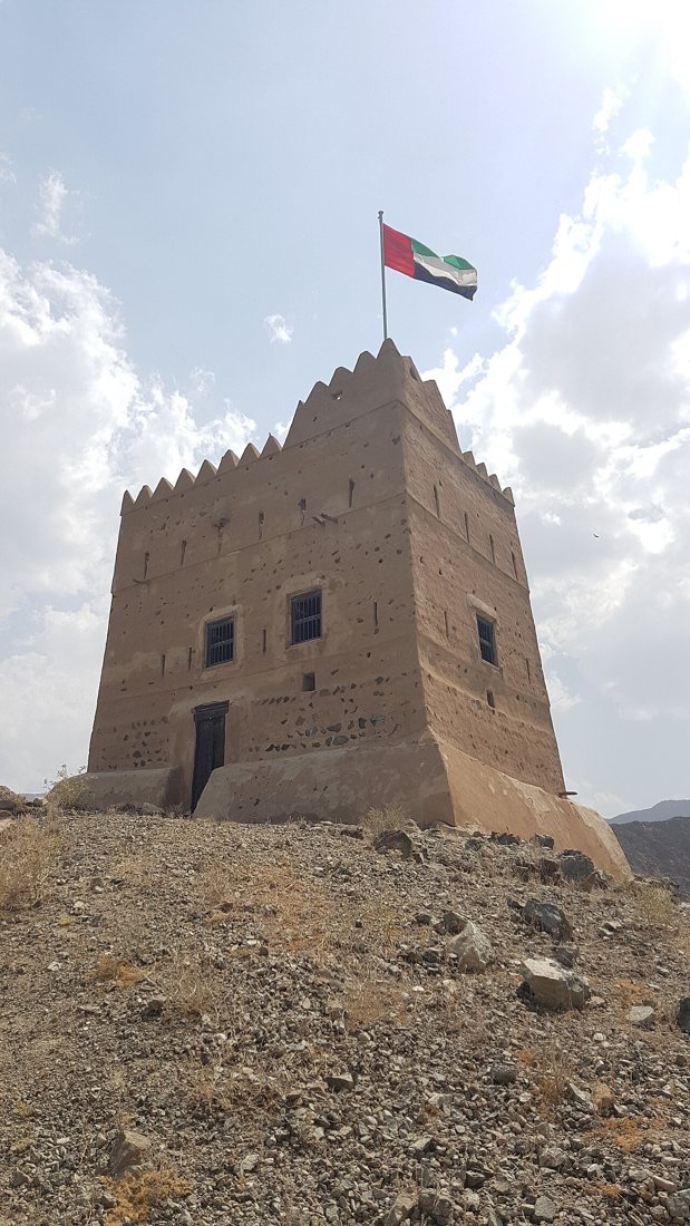 Al Hayl Fort watchtower and mountain valley